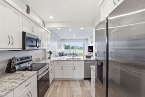 Fridge, microwave, oven, stovetop - #1412 - Golf and Lake Views - Updated -Sleeps 4 (Naples)