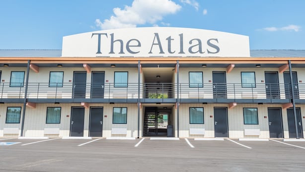 A two-story building with a sign reading 'The Atlas' above the entrance. -  The Atlas Hotel & Lofts (Goodlettsville)