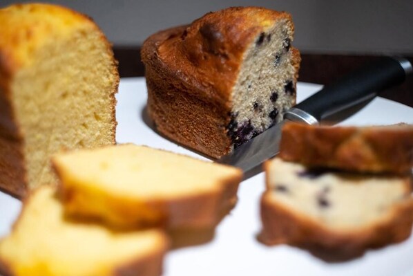 A loaf of bread with a knife. - Hotel Vale (Sarande)