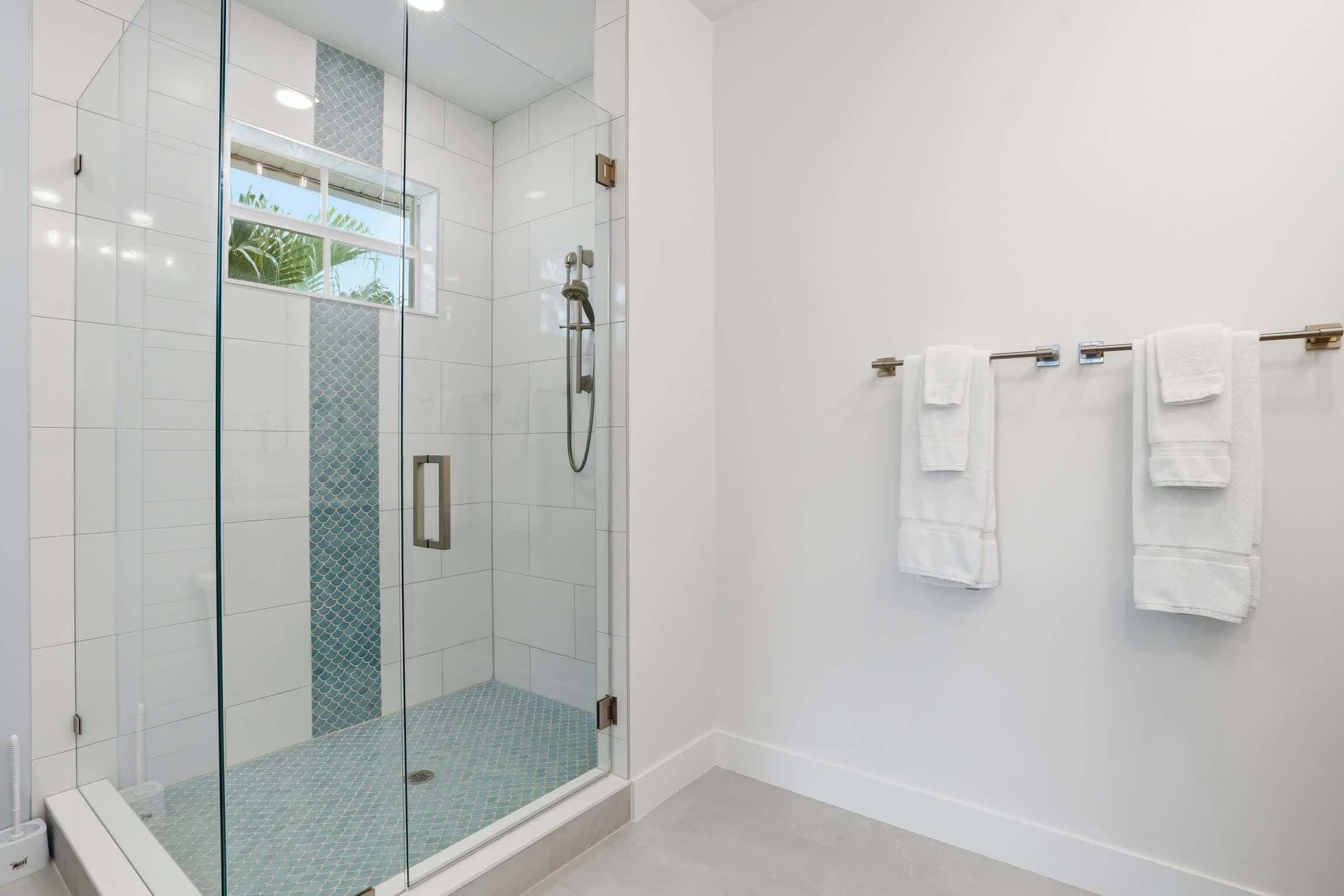Shower, hair dryer, towels, shampoo