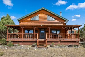A wooden cabin with a porch, a chimney, and a satellite dish. - Mountain Soul | ATV Access, Porch & Mountain Views (South Fork)