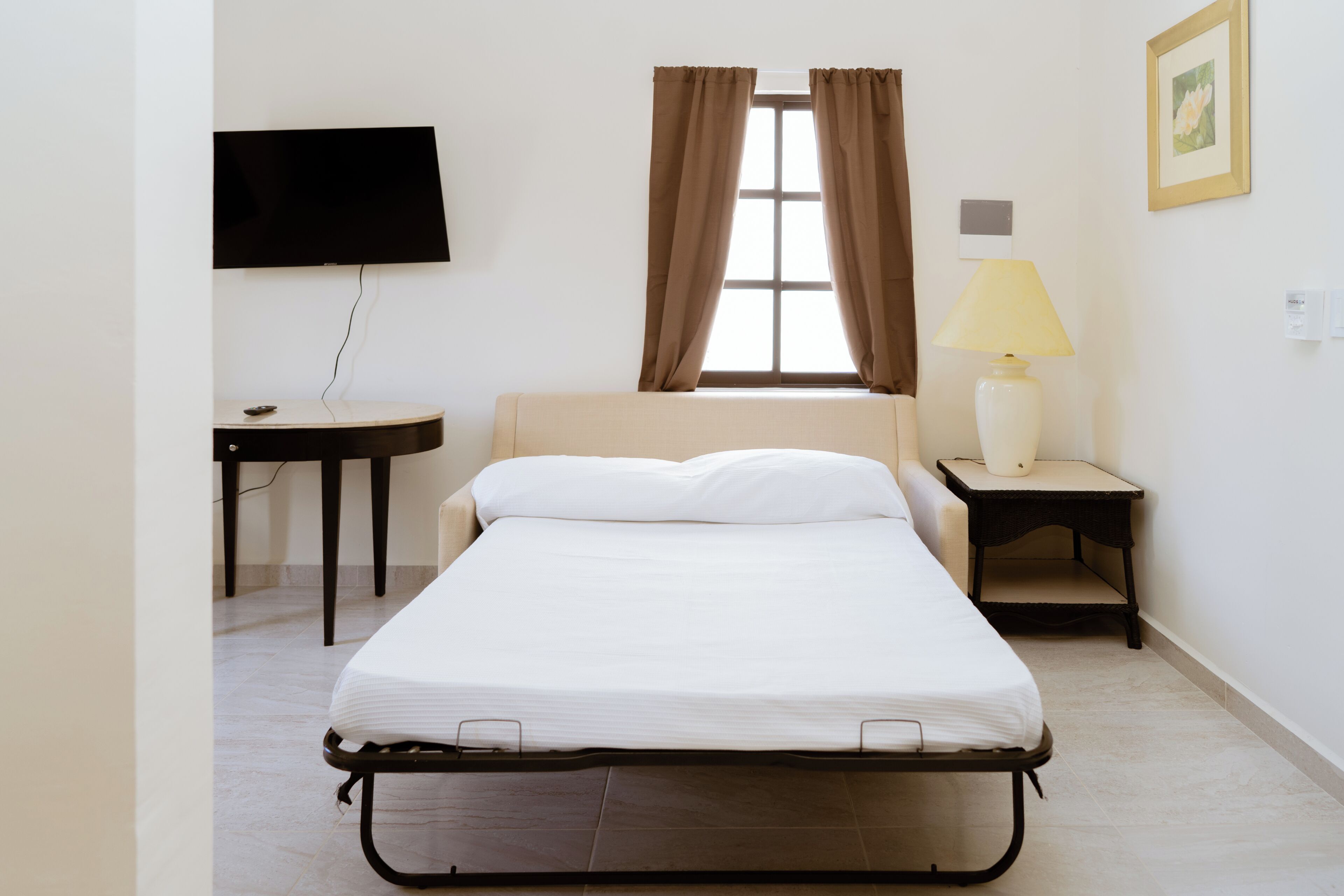Suite, varias camas | Sala de estar