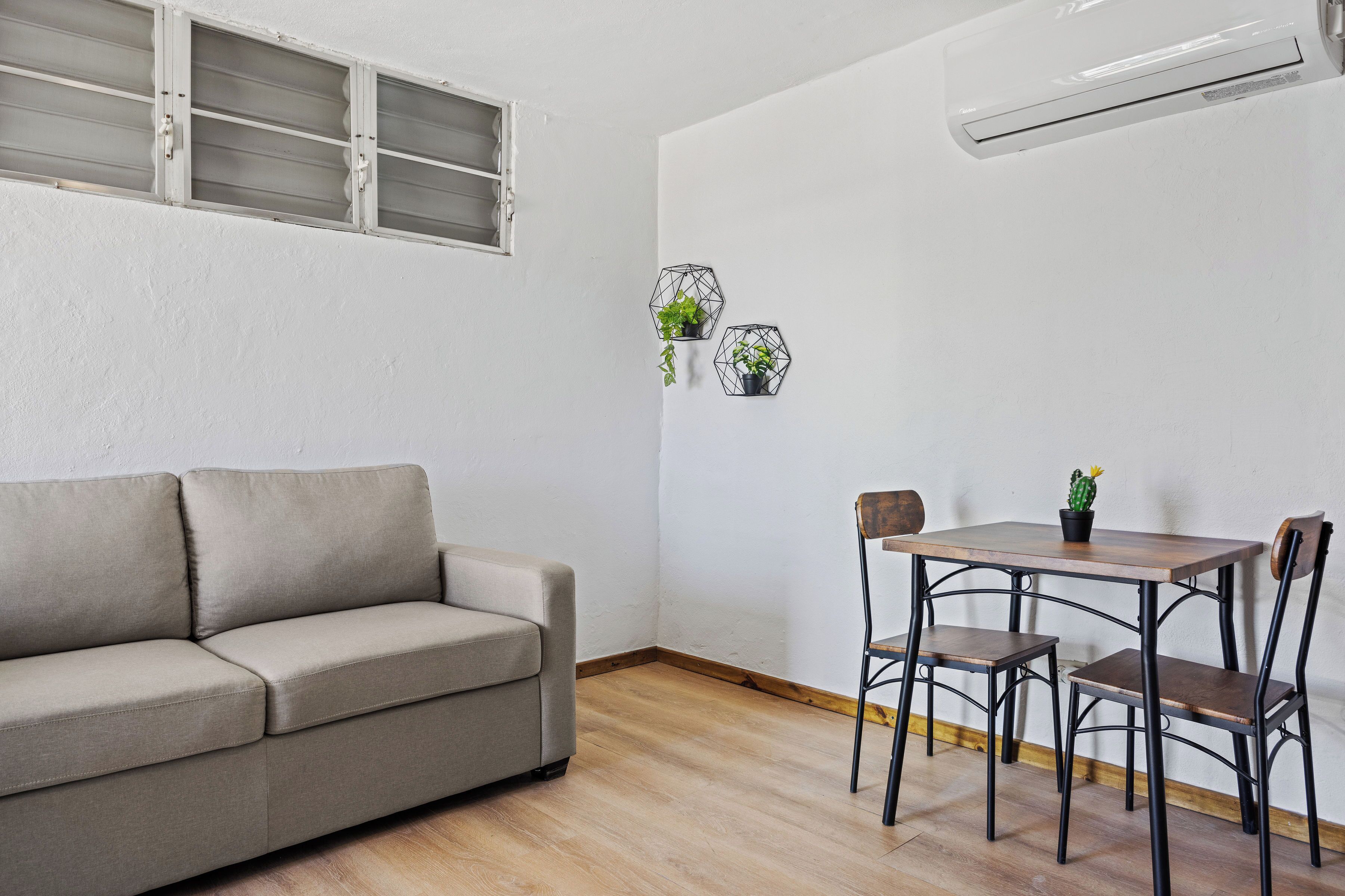 Apartment | Living area | 32-inch flat-screen TV with cable channels