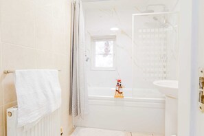 Shower, hair dryer, towels, shampoo