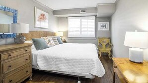 A bedroom with a bed, bedside tables, a dresser, a window, and a chair. - Chapel Gate 3BR Steps to City Dock & Naval Academy (Annapolis)