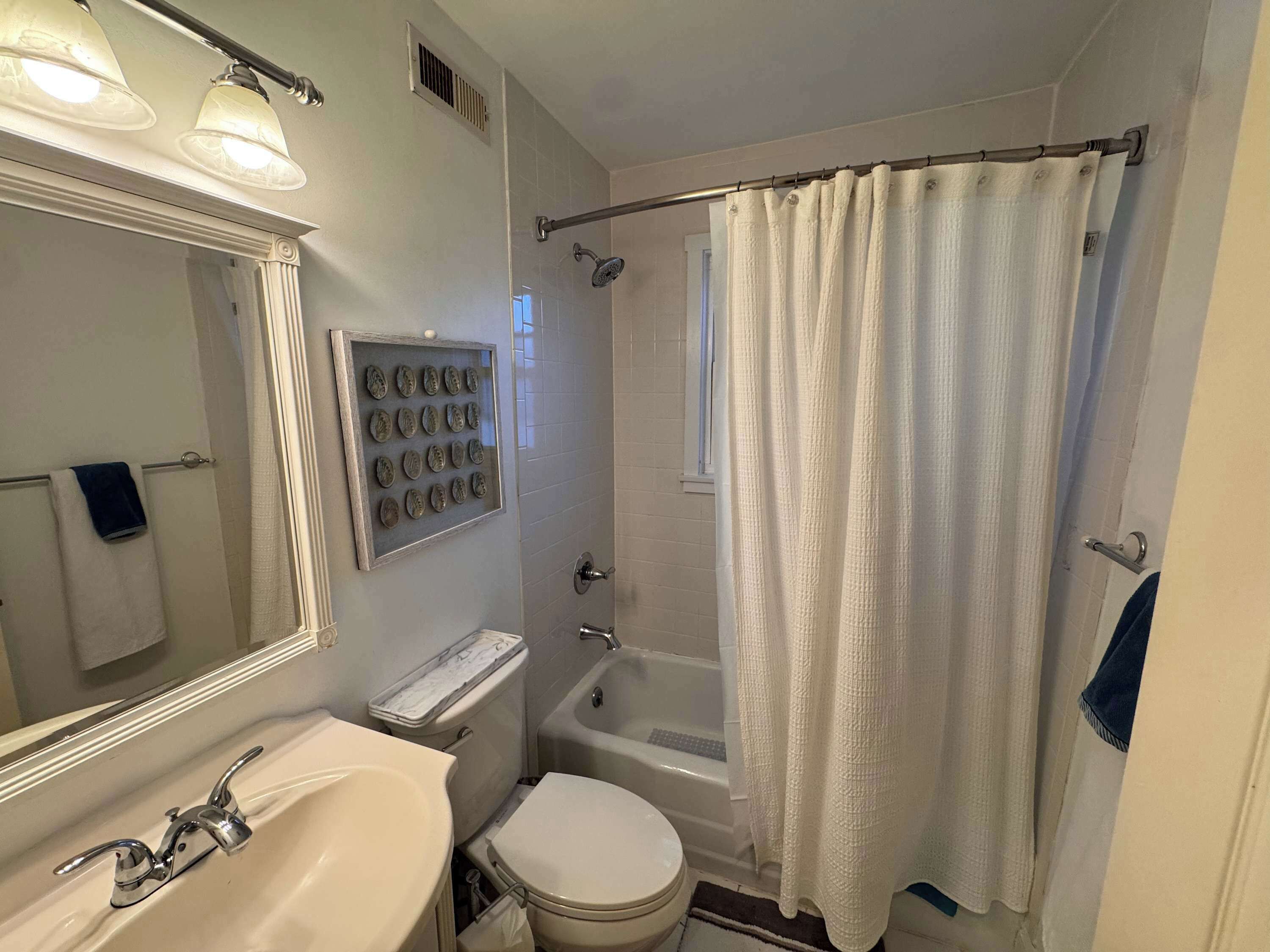 Shower, hair dryer, towels, shampoo