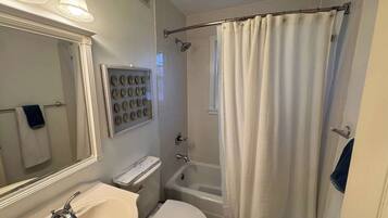 Shower, hair dryer, towels, shampoo