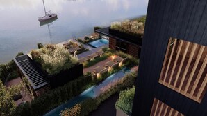 A modern building with a rooftop garden, a swimming pool, and a dock with a sailboat. - Vogl's Nest  (Fuschl am See)