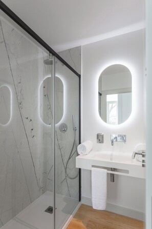 Shower, hair dryer, towels, soap