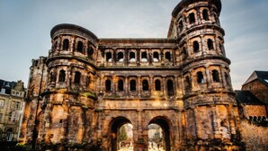A historic stone building with multiple arches and a central tower. - Vacation apartment - Cozy apartment in the Saarland (Losheim am See)