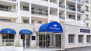 A multi-story hotel with a prominent 'Royal Regency' sign, a covered entrance, and a balcony on the upper floors. - Beautiful 3-BR / 2 bath apartment in Paris / Vincennes neighborhood July 11-18 (Vincennes)