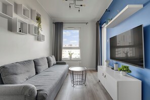 Apartamento, balcón, vistas a la ciudad | Zona de estar