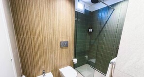 A bathroom with a wooden panel wall, a glass shower enclosure, and a white toilet. - Parthenope | Penthouse Pignasecca – Design Suite (Naples)