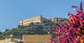 A historic building on a hill with a clear sky. - Parthenope | Penthouse Pignasecca – Design Suite (Naples)