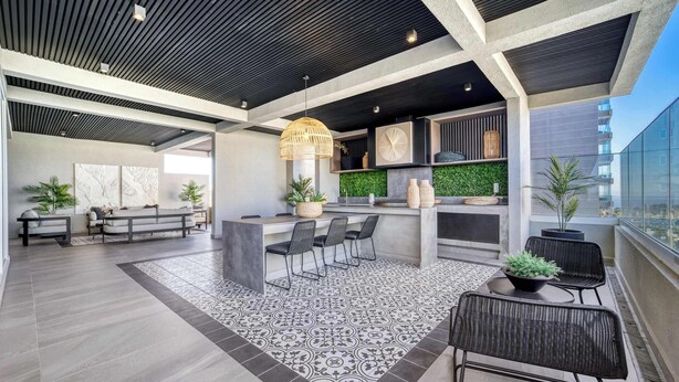 A modern outdoor lounge area with a bar, seating, and a patterned floor. - Modern Coast Concón- 2D w/ Wifi (Concón)