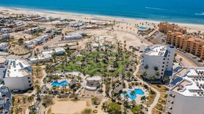 A resort with multiple buildings, a central pool area, and a beach. - Casa Blanca Villa 9 | 3BR Condo | Sleeps 6 (Puerto Peñasco)