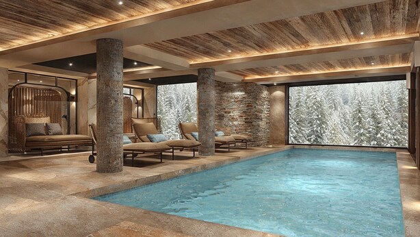 Ein moderner Poolbereich im Innenbereich mit Steinsäulen, Liegestühlen und Blick auf schneebedeckte Bäume.