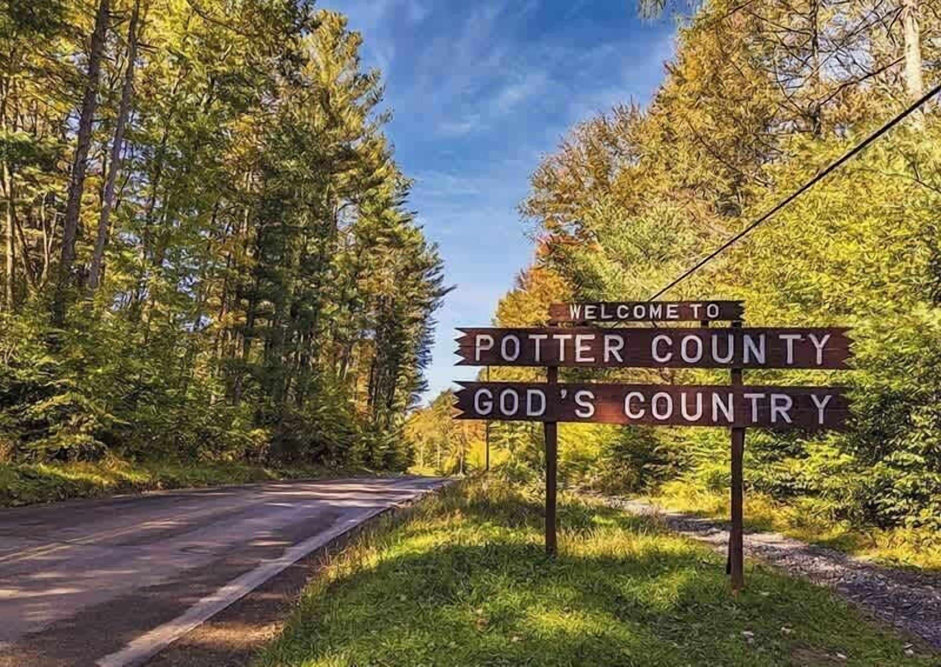 A road sign welcoming visitors to Potter County, labeled as 'God's Country.'