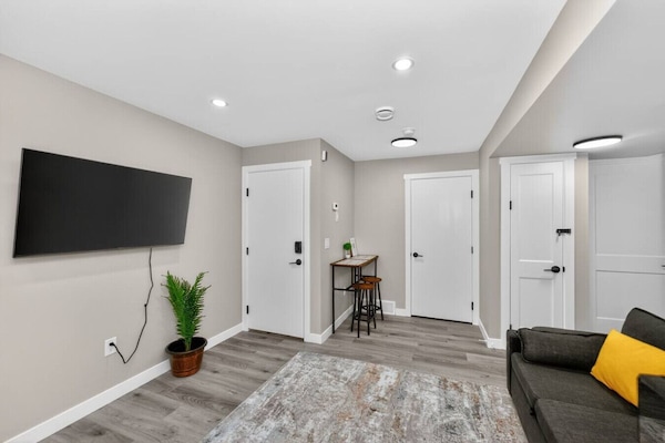 Spacious living area with smart TV and seating