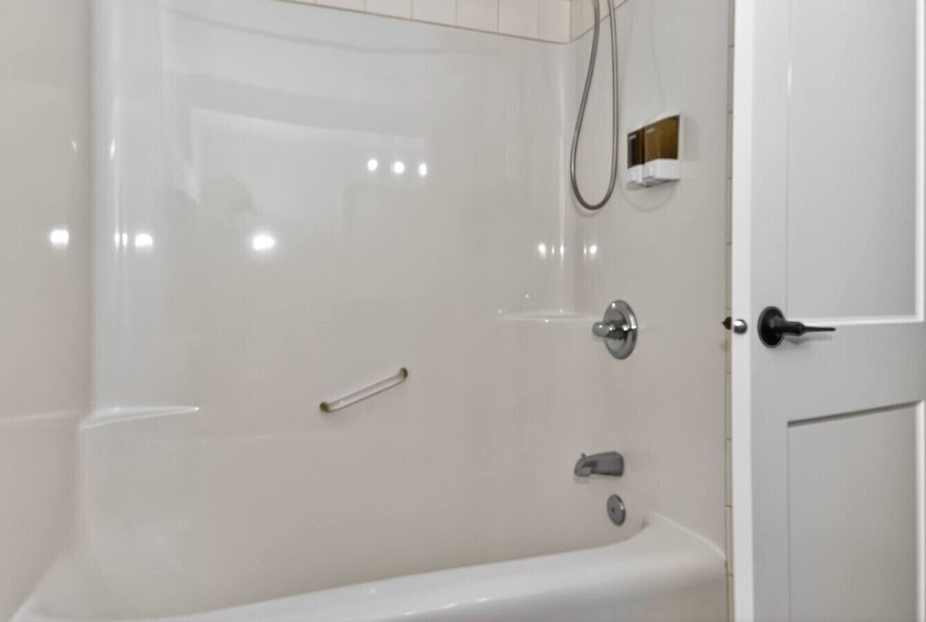 Full bathroom with bathtub and shower