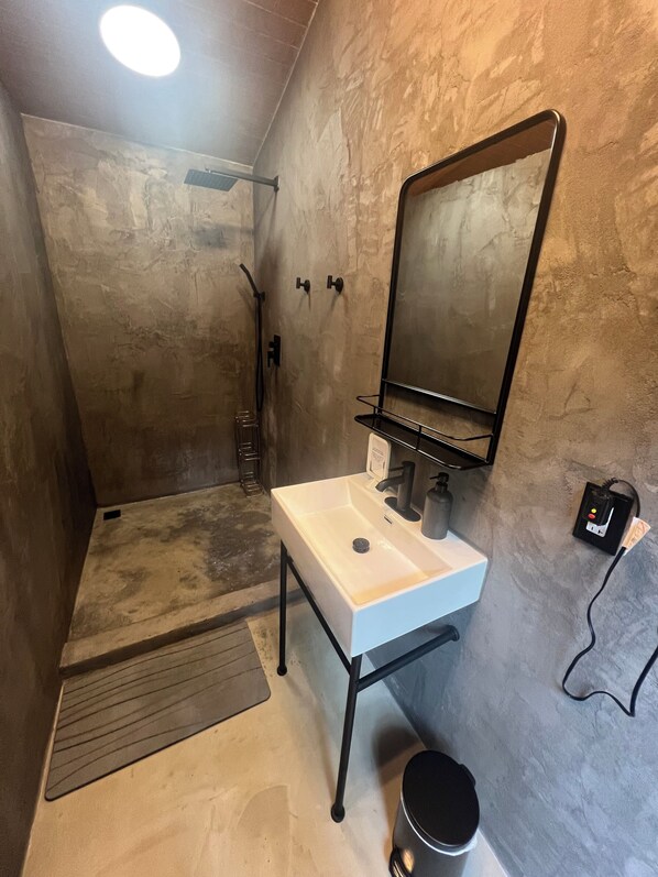 Shower, hair dryer, towels, toilet paper