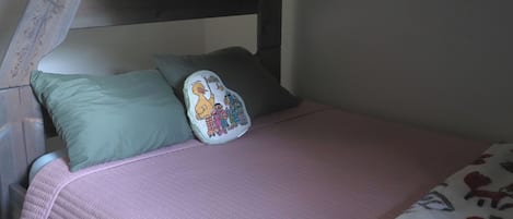 A bunk bed with a single bed below.