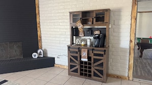 A room with a fireplace, a coffee station, and a billiards table. - Quiet Country Getaway ,quiet, and spacious getaway (Belen)