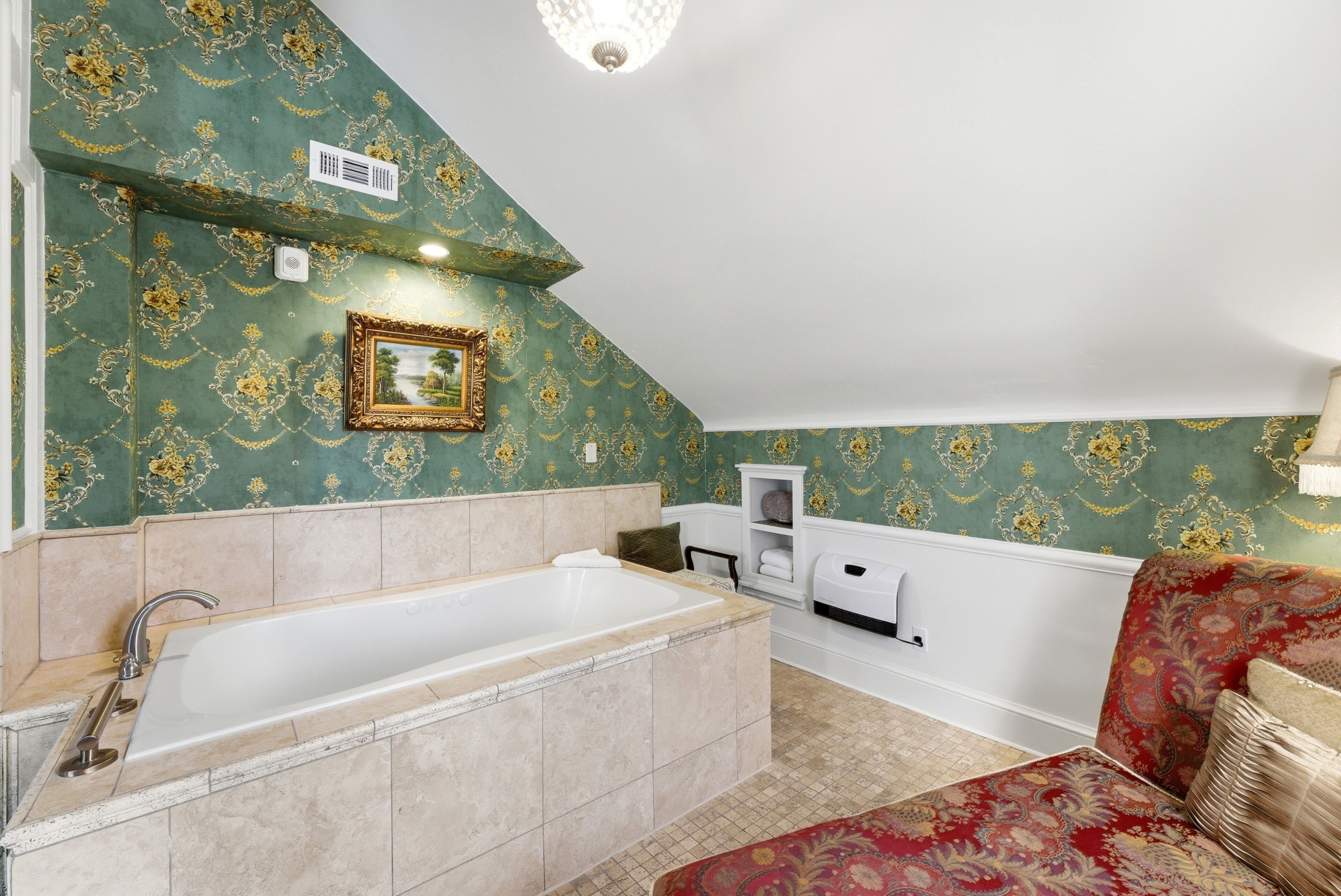 A bathroom with a bathtub, a towel rack, and a shelf with toiletries.