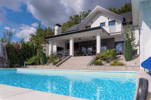 Modern villa with indoor and outdoor pool, sauna and scenic views