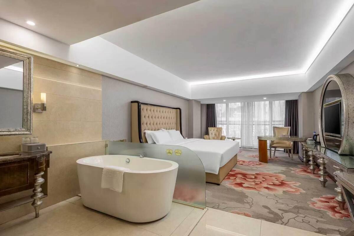 Premium bedding, desk, laptop workspace, blackout drapes