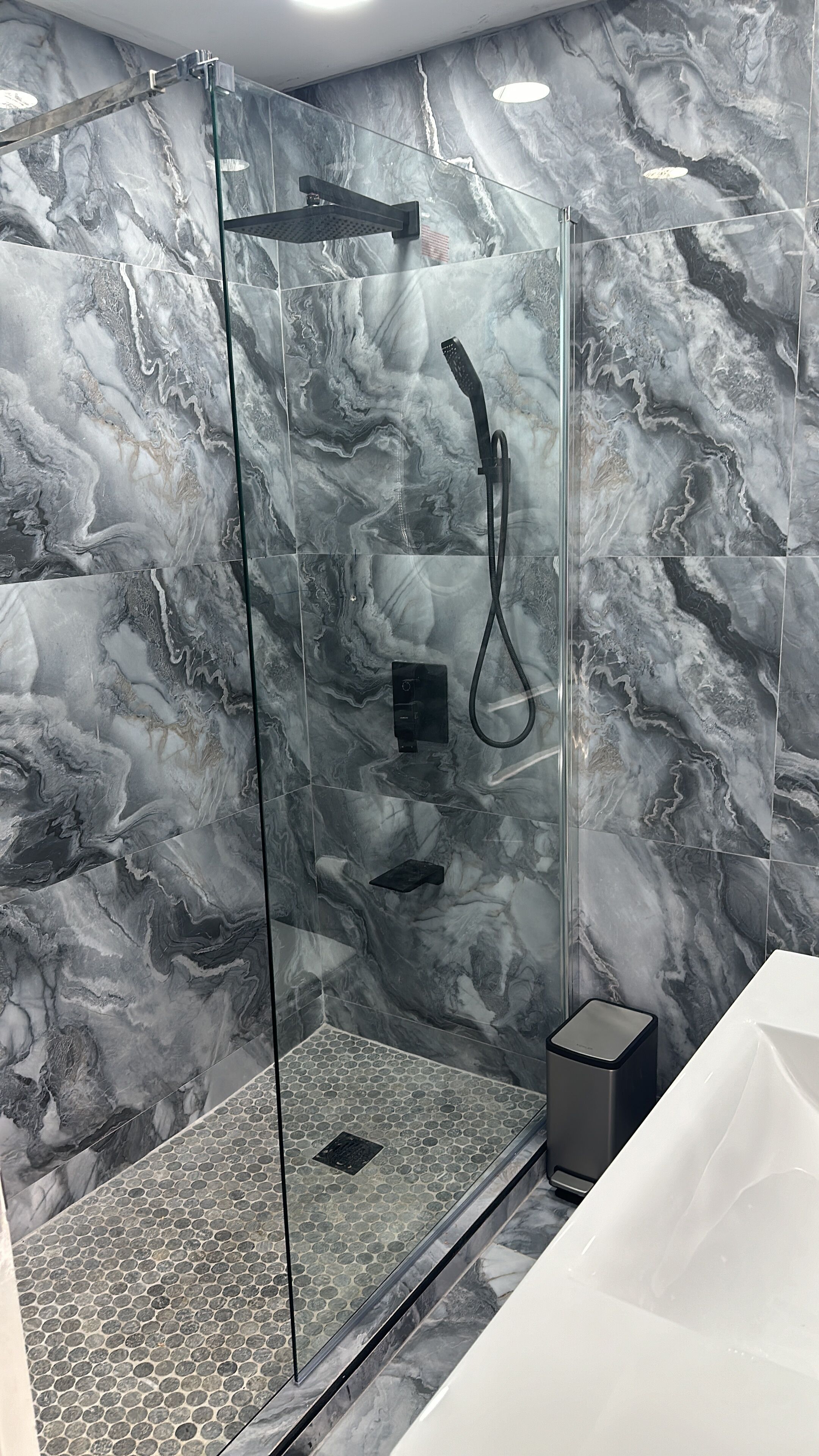 Shower, hair dryer, towels, toilet paper