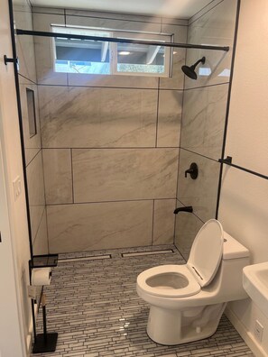 Shower, towels, soap, toilet paper