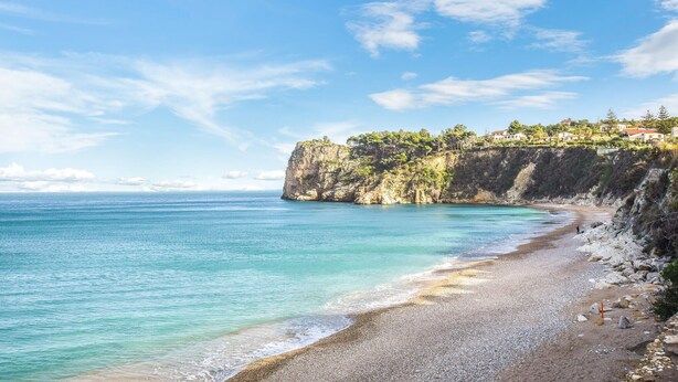 A coastal landscape with a clear sky, a pebble beach, and a cliff with vegetation. - 2 bedroom lovely home in Castellammare del Golf (Castellammare del Golf)