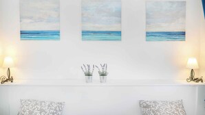 A room with a bed, two bedside lamps, and three wall-mounted paintings of a seascape. - Villa VILLA MARIJANA 6+0 (Srima)