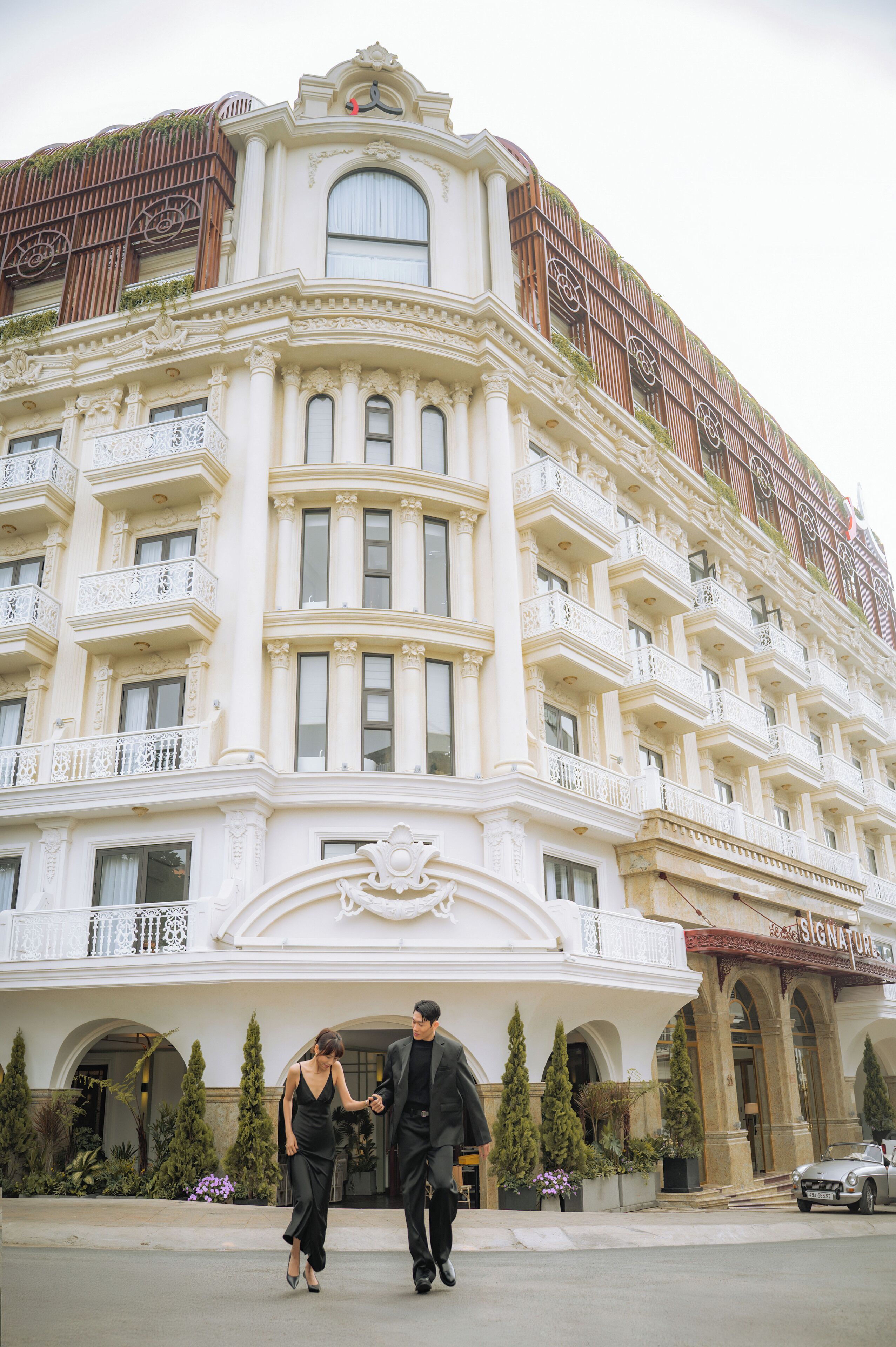 A historic building with ornate balconies and a classic architectural style.