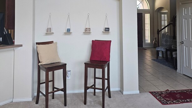 A spacious foyer with a high ceiling, a wooden staircase, and a view into the living area. - Fresh Baked Cookies /Brownies with  check in from Sweet Vegan Cookie Company (Mesquite)