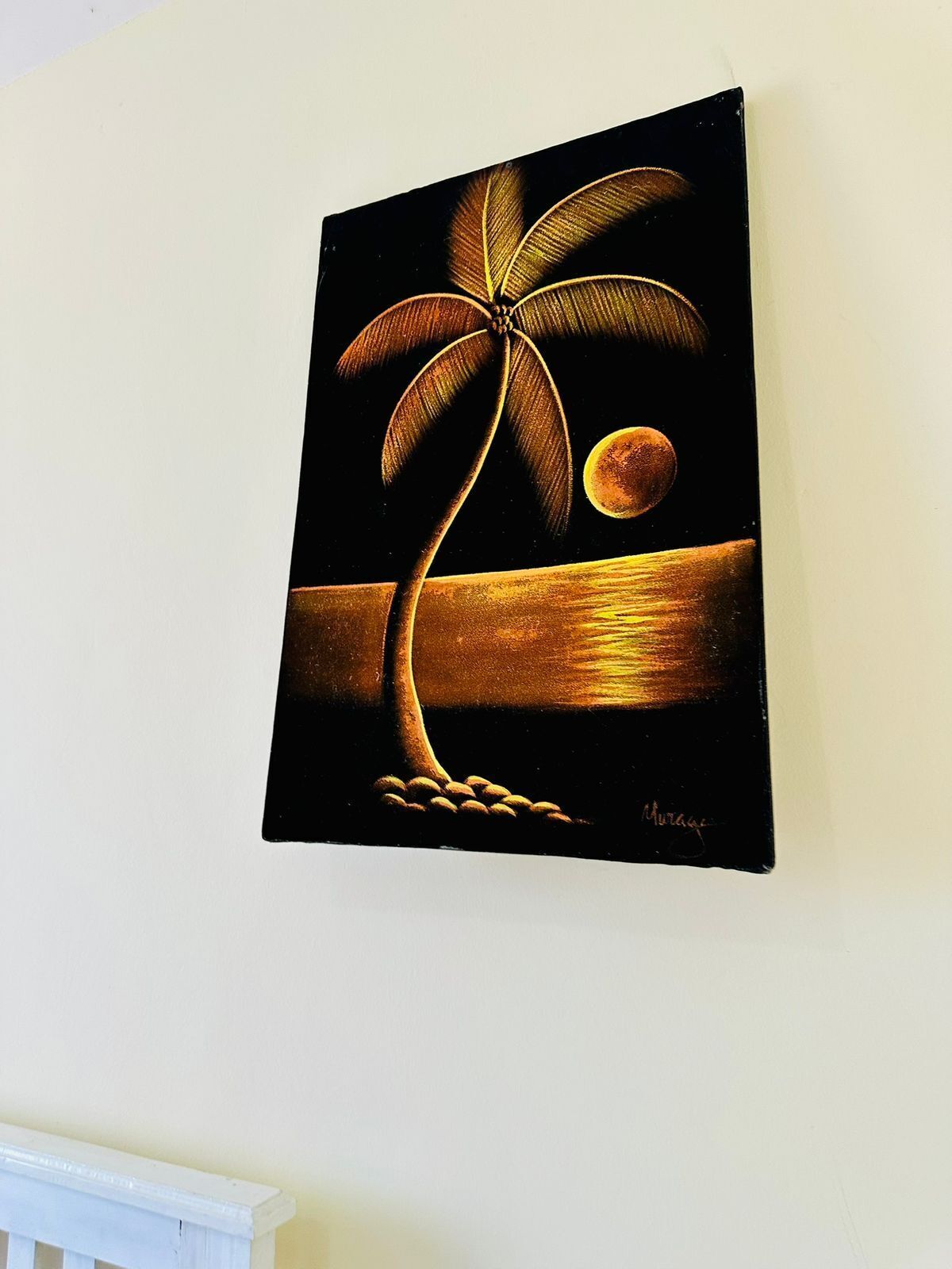 A painting of a palm tree against a dark background with a moon.