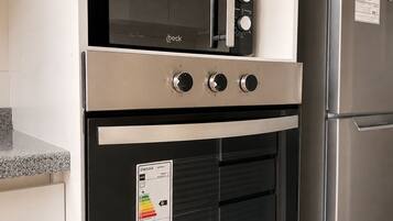 Coffee/tea maker, fridge, microwave, oven
