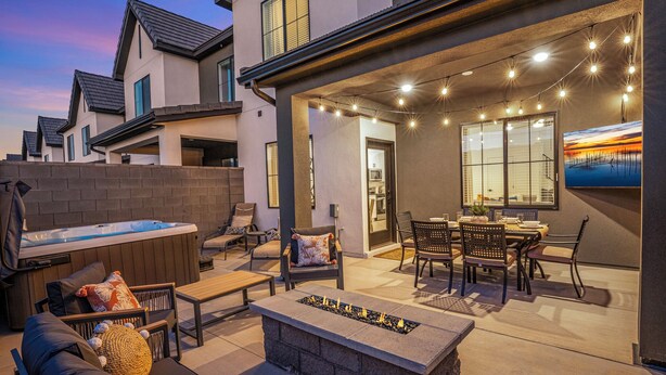 A patio area with outdoor seating, a hot tub, and a fire feature. - Skyline 1742, Private Spa, Fire Pit, Community Amenities! (Washington)