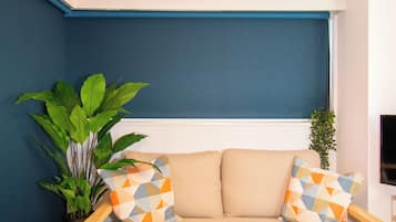 Apartment | Living area | 32-inch flat-screen TV with cable channels