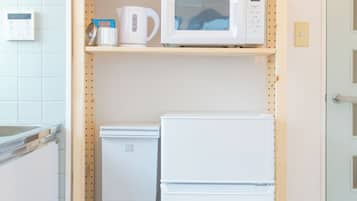 Apartment | Private kitchen | Full-size fridge, microwave, stovetop, cookware/dishes/utensils