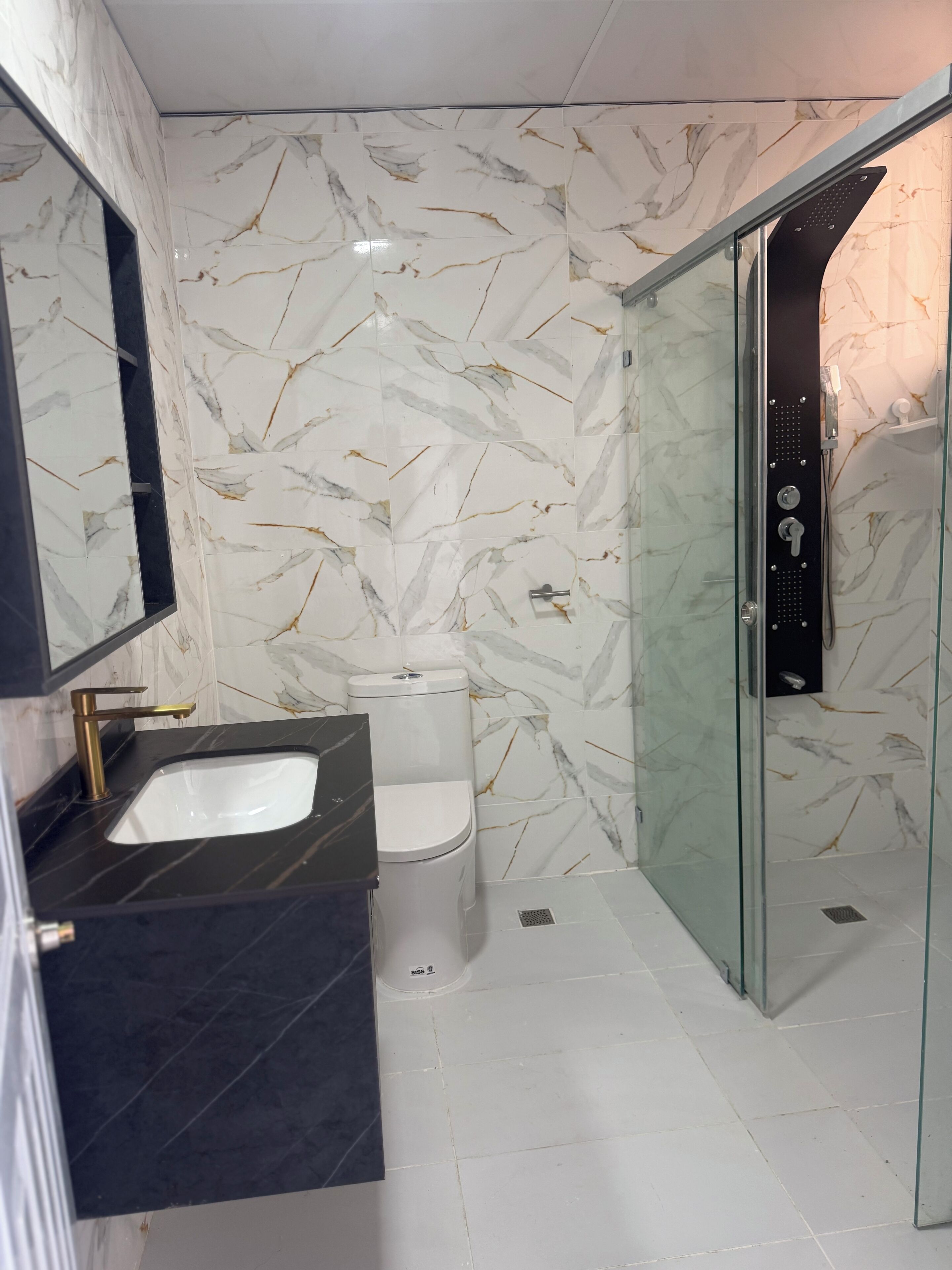 Shower, towels, soap, toilet paper