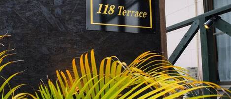 A sign with '118 Terrace' indicating a location.