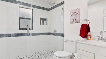 Shower, hair dryer, towels, soap