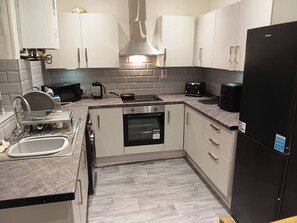 Private kitchen - Dale Combe  is a  mid terrace house (Middleton)