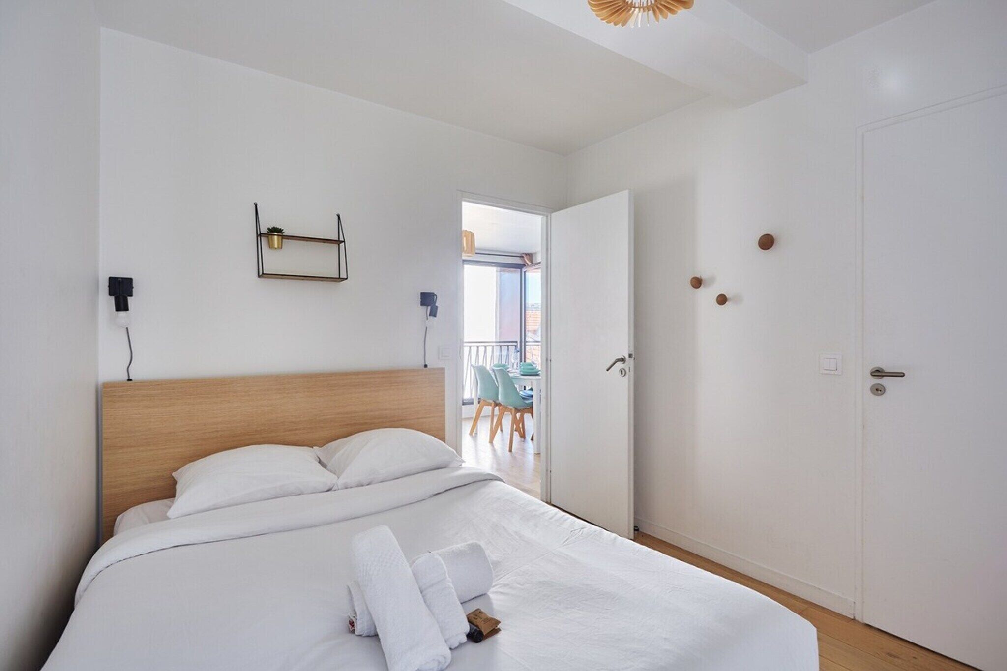 Desk, iron/ironing board, bed sheets