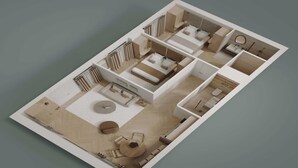 Ein 3D-Modell eines Hotelzimmers mit Bett, Bad, Sitzgelegenheit und einem kleinen Tisch.
