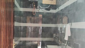 A bathroom with a toilet, sink, and shower. - Thorn Kitchen &Hideaways (Hoshiarpur)