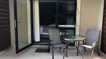 Luxury Suite, Patio, Garden View | Outdoor dining