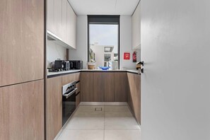 Fridge, microwave, oven, stovetop - Modern 1BR Escape w Balcony Views and Community Lifestyle (Arjan)